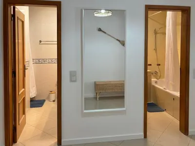 a bathroom with a shower and a glass door at SummerSalt Apartment - Albufeira Old Town in Albufeira