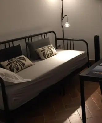 a bed with two pillows on it in a room at Pátio da Várzea in Albufeira