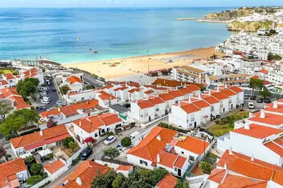 an aerial view of a town with a beach at Casa Bela Mar in Albufeira