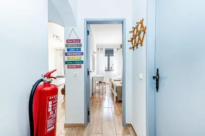 a kitchen with a counter with a sink and a dishwasher at Santa Eulália Terrace in Albufeira