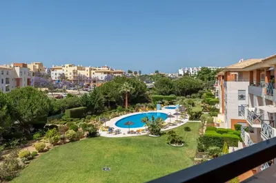 a view of the pool from the balcony of a apartment at Penthouse with Pool View in Albufeira by Lovelystay in Albufeira