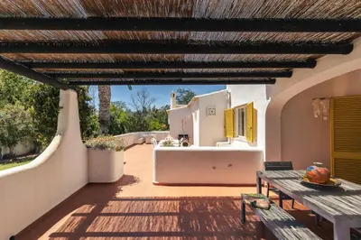 an external view of a house with a patio at Aldeamento Aldeia do Golf V3 in Vilamoura