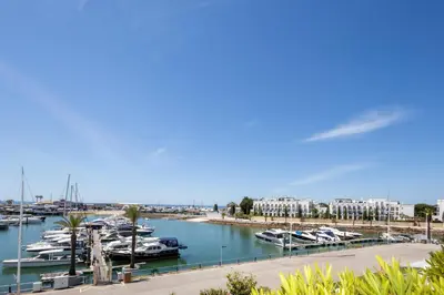 a marina with boats docked in a harbor at Allianca Marina - Luxury apartment by HD in Vilamoura