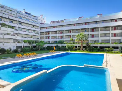 a large swimming pool in front of a hotel at Allianca Marina - Luxury apartment by HD in Vilamoura