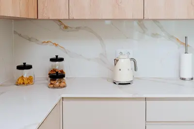a kitchen counter with a coffee maker on it at Terra X Apartments in Faro