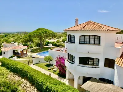 a large white house with a swimming pool at Villa SOLAR DO MONTE 5 in Albufeira