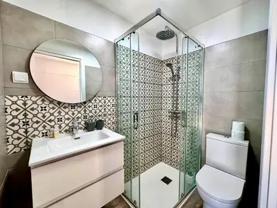 a bathroom with a shower and a toilet and a sink at Villa SOLAR DO MONTE 6 in Albufeira