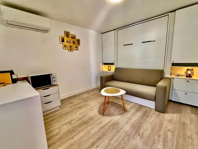 a small living room with a couch and a table at Villa SOLAR DO MONTE 6 in Albufeira