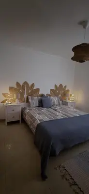 a bedroom with a large bed with a blue blanket at Quinta Do Vale 32 by AL in Guia