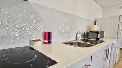a kitchen with a sink and a counter top at Tenis Golf Mar A209 - CD 309 - Sleeps 2 adults and 2 children in Vilamoura