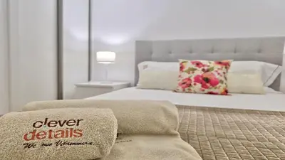a bedroom with a bed with a pillow with the words deliver details in the no at Tenis Golf Mar A209 - CD 309 - Sleeps 2 adults and 2 children in Vilamoura