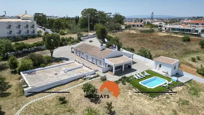 a bathroom with a toilet and a sink and a shower at #331 Casa Chico Rita by Home Holidays in Sesmarias