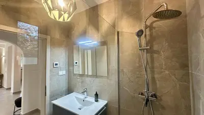 a bathroom with a sink and a shower at Amêndoa by Check-in Portugal in Quarteira