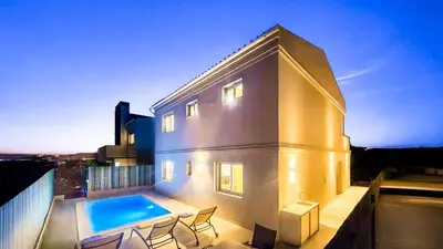 a house with a swimming pool on top of it at Amêndoa by Check-in Portugal in Quarteira
