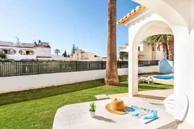 a patio with a table and a view of a yard at Villa Julia Gale in Guia
