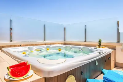 a large bath tub with fruits in it at Villa Sunflower in Albufeira