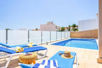 a kitchen with a fireplace in a house at Villa Sunflower in Albufeira