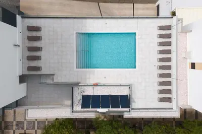 an aerial view of a building with a swimming pool at Terracos de Quarteira II Caribe by Real Properties in Quarteira