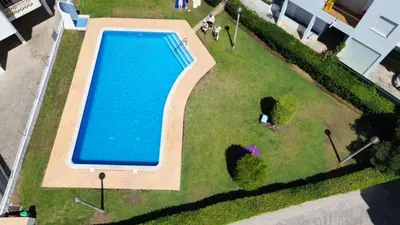 an overhead view of a swimming pool in a park at Sun House in Albufeira