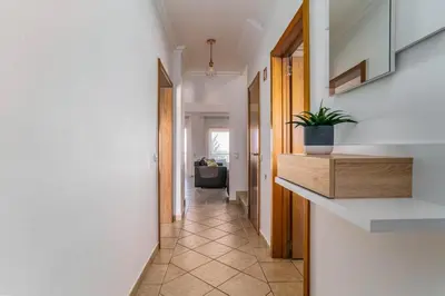 a hallway of a house with a plant on the counter at Bright 3-BR in Guia with Shared Pool by Lisbeyond in Guia