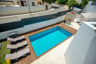 an overhead view of a swimming pool on a building at Villa Velluto in Albufeira