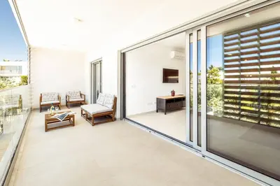 an indoor balcony with a view of a living room at Modern 1-Bed Apartment with Terrace Albufeira in Albufeira