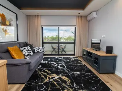 a bathroom with a sink and a glass shower at Oásis Apartment by Stay ici Algarve Holiday Rental in Albufeira
