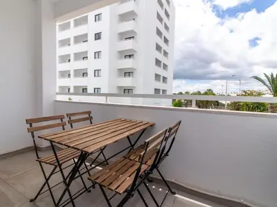a kitchen with a washer and a washing machine at Oásis Apartment by Stay ici Algarve Holiday Rental in Albufeira