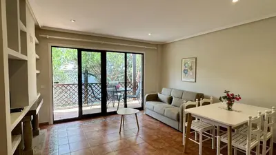 a living room with a couch and a table at Sun by Check-in Portugal in Albufeira