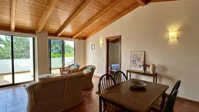 a living room with a table and chairs at Sun by Check-in Portugal in Albufeira