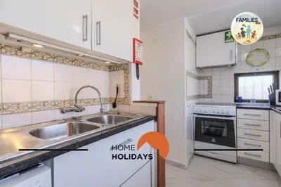 a kitchen with a sink and a stove at #329 Families Only - Jacaranda by Home Holidays in Albufeira