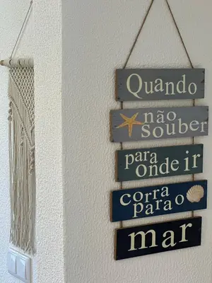 a group of street signs hanging on a wall at Delta Marina Vilamoura in Quarteira