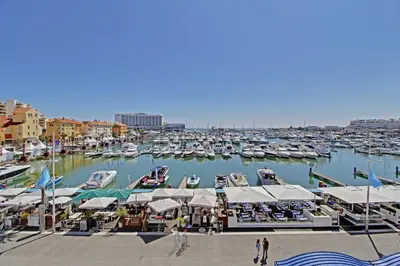 a marina filled with lots of boats in the water at Terrazza Beach & Golf in Quarteira