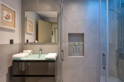 a bathroom with a shower and a sink at Deluxe Ancao in Almancil