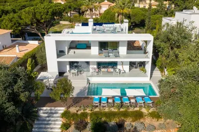 an aerial view of a house with a swimming pool at Deluxe Ancao in Almancil