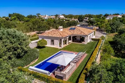 an aerial view of a house with a swimming pool at Villa Zambujal in Boliqueime