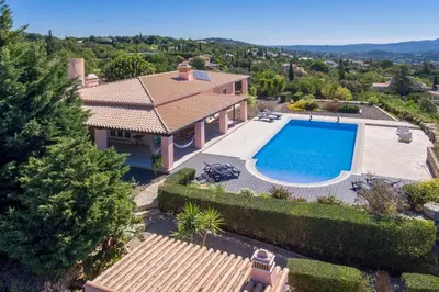 an aerial view of a house with a swimming pool at Villa Mujeira in Loulé