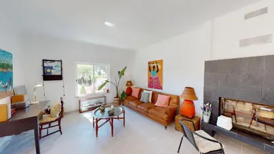 a living room with a couch and a fireplace at Villa Sunset,sleeps 9,heatable pool,walk to marina in Vilamoura
