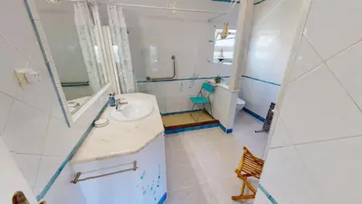 a bathroom with a sink and a mirror at Villa Sunset,sleeps 9,heatable pool,walk to marina in Vilamoura