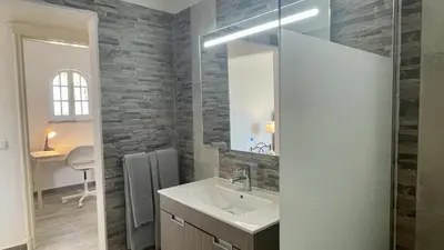 a bathroom with a sink and a mirror at Laranjal by Check-in Portugal in Quarteira