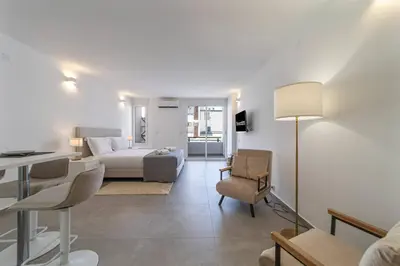 a living room with a couch and a table at Downtown Apartment - BE by HelloVacations in Albufeira