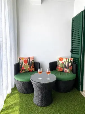 a living room with a red couch and a table at Casa Sérénity By Calyferias in Guia