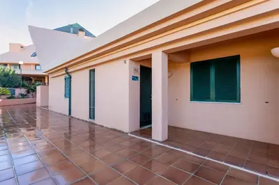 a view of a house with a tiled courtyard at Pearl Harbor 3 BDR Flat VLM Marina by LovelyStay in Quarteira
