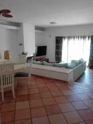 a desk with a chair and a mirror in a room at Vilamoura townhouse in private gated condominium in Quarteira