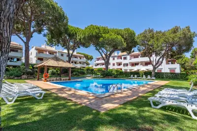 a villa with a swimming pool in a resort at Pool Apartment Vilamoura near Old Village in Quarteira