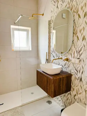 a bathroom with a sink and a mirror at Fernando Pessoa Villa in Faro