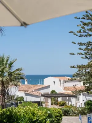 a view of the ocean from a building at Casa Aurora in Vale do Lobo