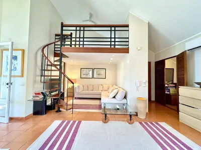 a living room with a loft bed and a couch at Vilamoura Marina View 3 by Homing in Vilamoura