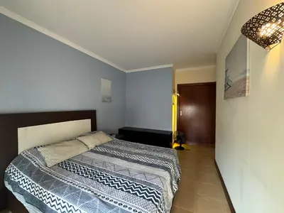 a bedroom with a large bed in a room at T1 dos Salgados in Guia