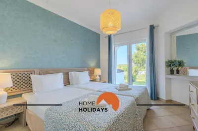 a swimming pool at a resort with palm trees at #322 Albufeira Family Stay by Home Holidays in Albufeira